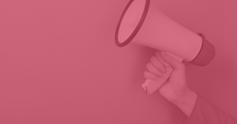 Hand holding bull horn.