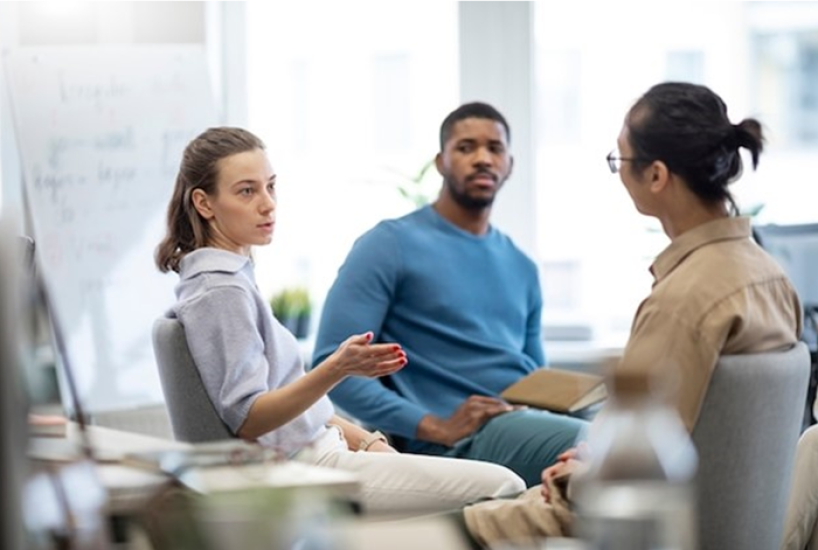 three people in discussion
