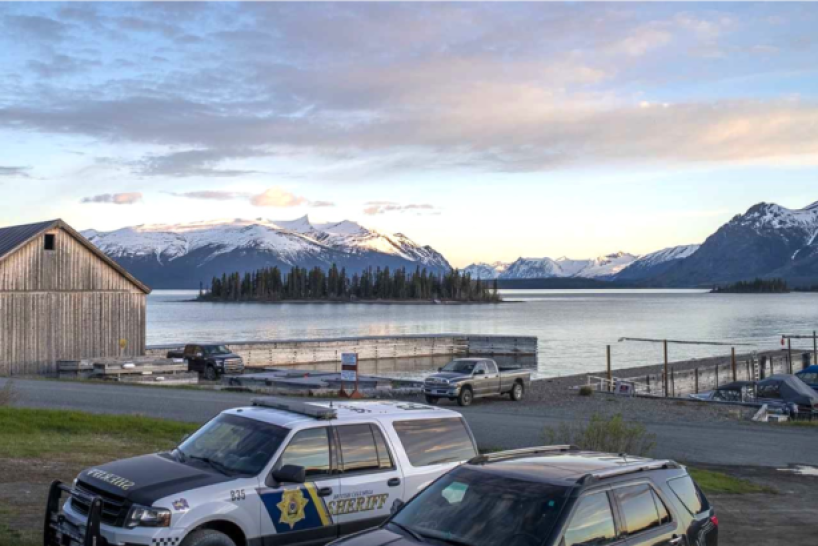 police vehicles against scenic backdrop