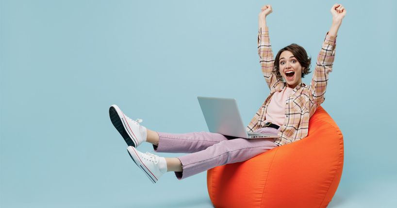 excited woman in beanbag