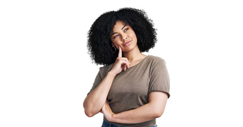 Woman wearing brown tshirt with her finger to the side of her face looking thoughtful.