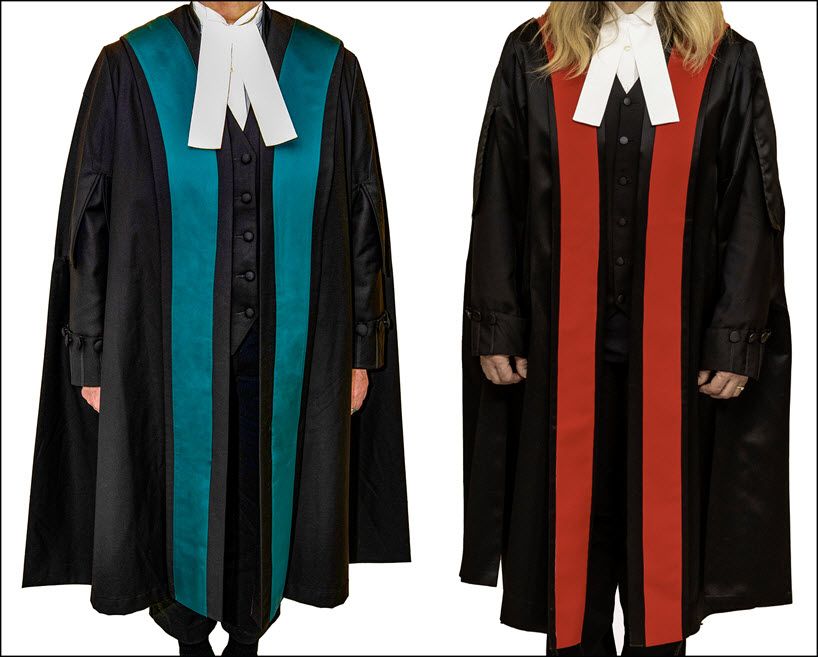 two people wearing judges robes, one with blue stripes the other with red stripes