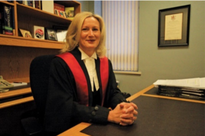 Judge Lowe sitting behind desk