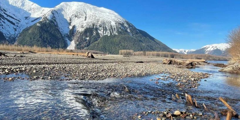 Skeena River with mountains in the background.