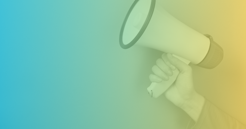 Hand holding bullhorn.