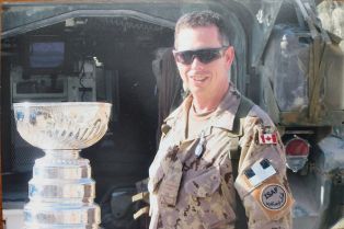 Judge Reeves admiring the Stanley Cup in Afghanistan